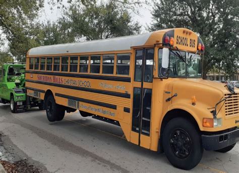 school bus skid steer hauler|school bus towing services.